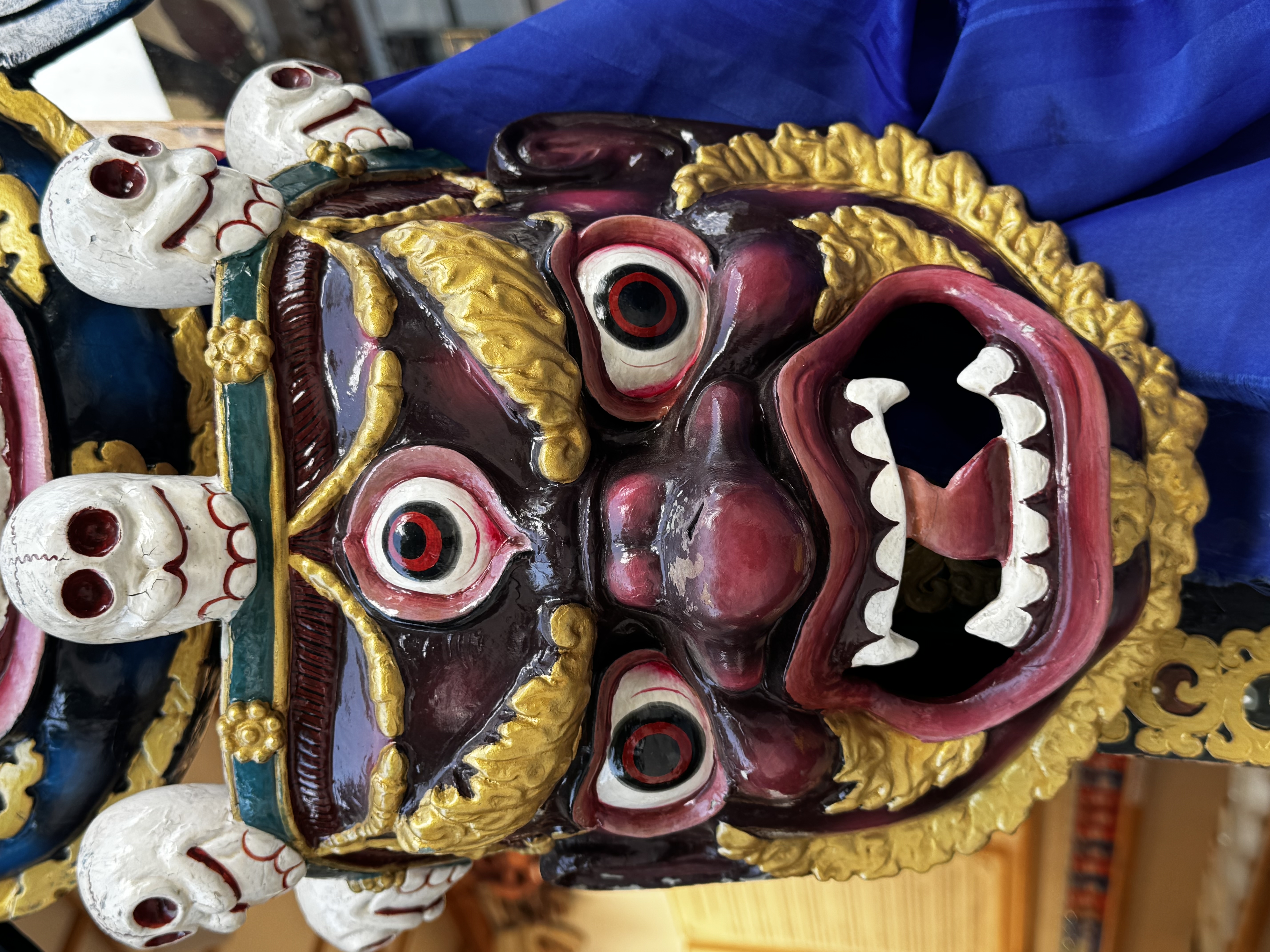Hand-carved ceremonial mask, colorful and history rich