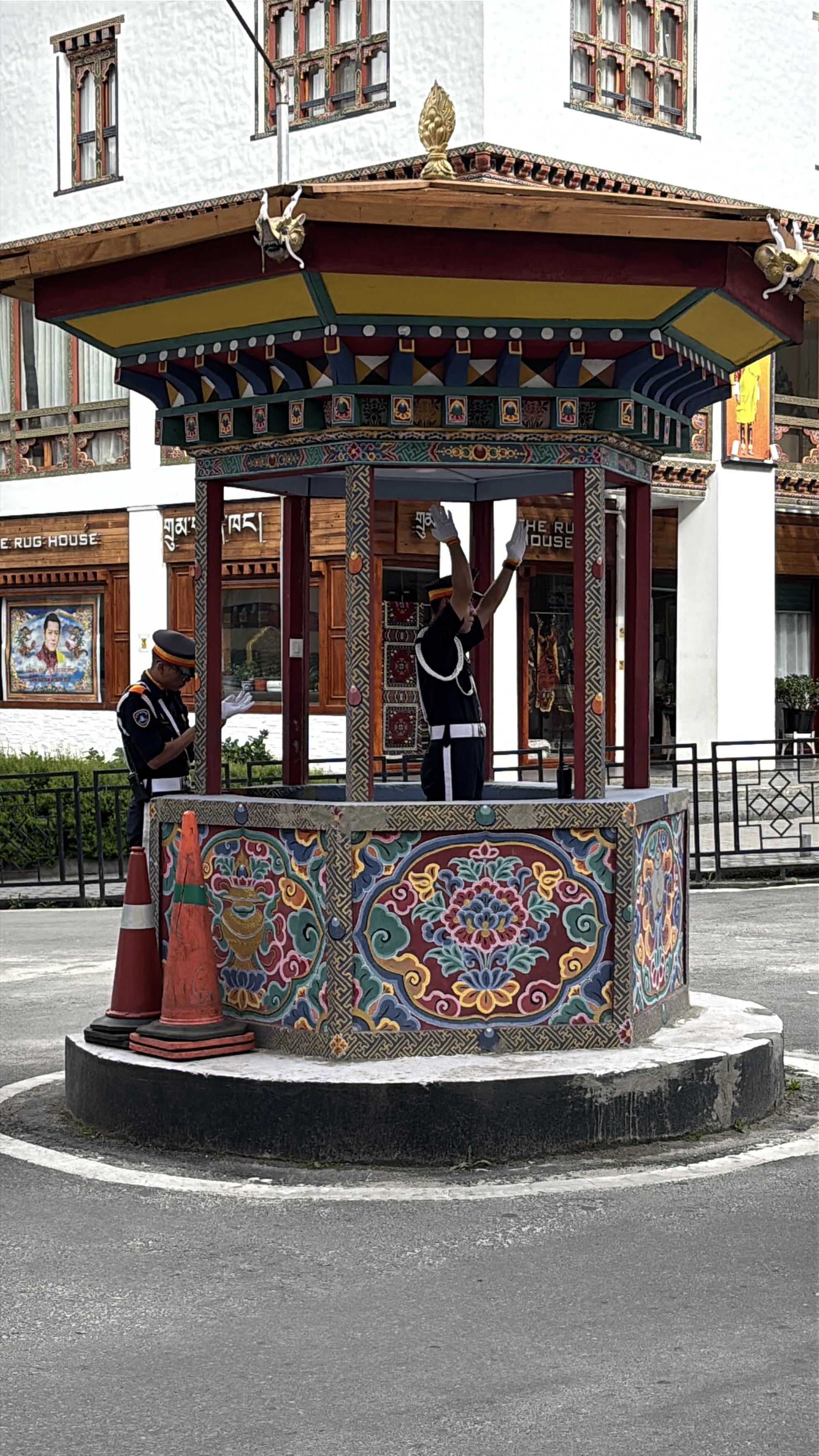 Thimphu's famous hand-directed traffic junction — the city tried lights once and walked them back within days