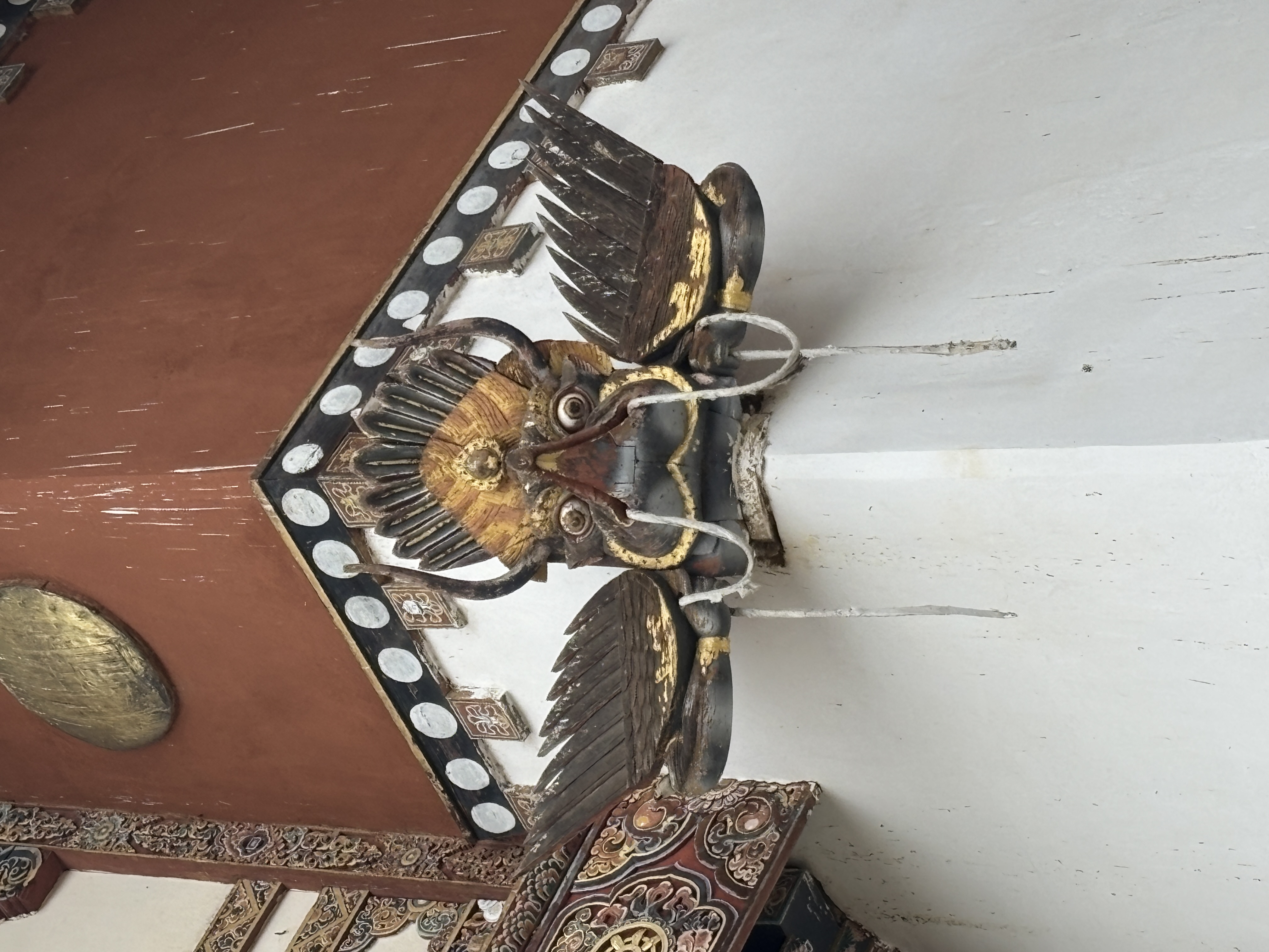 Ornate woodwork along the monastery walls
