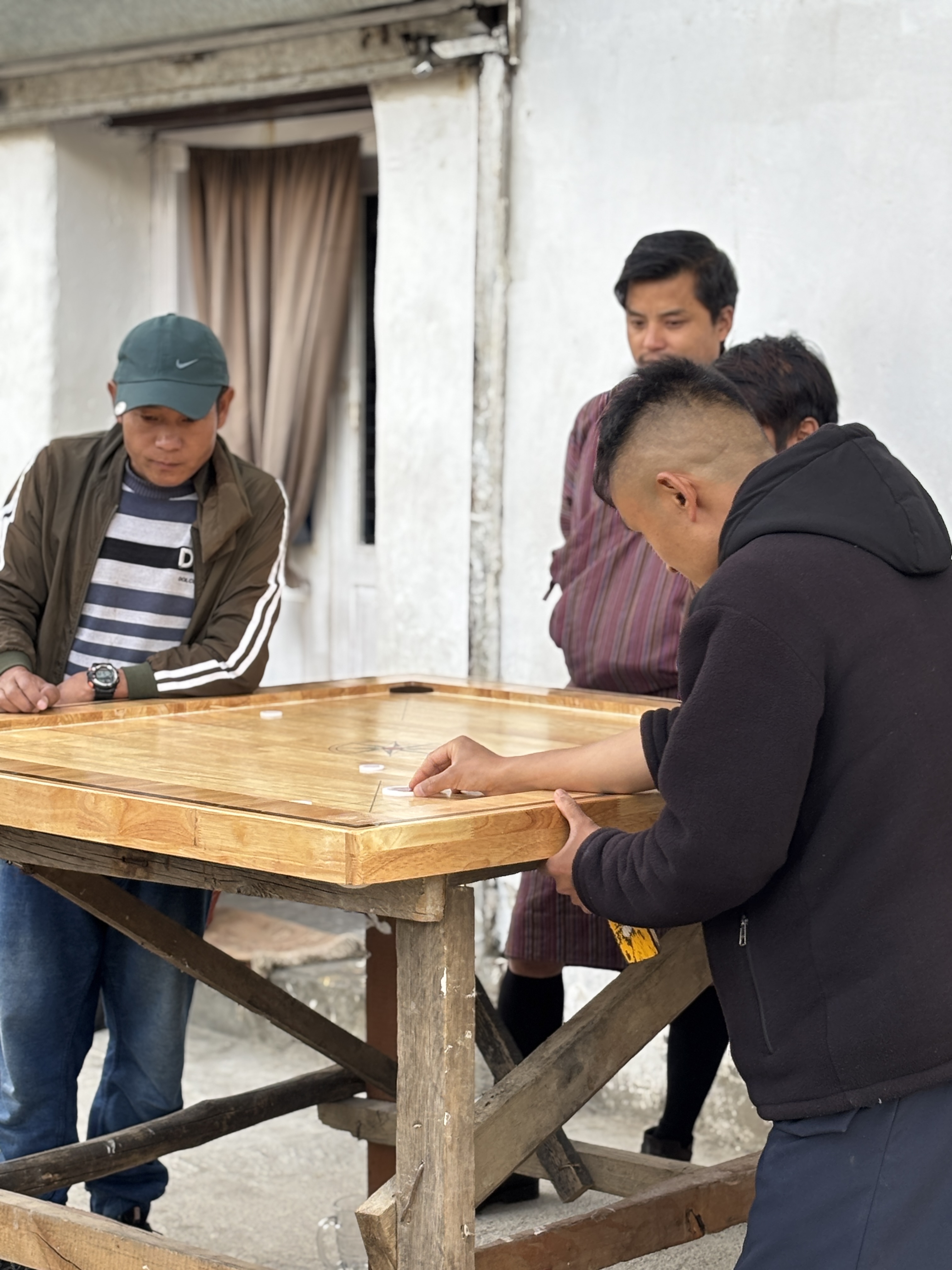 Saw people play carrom in a languid way on street sides