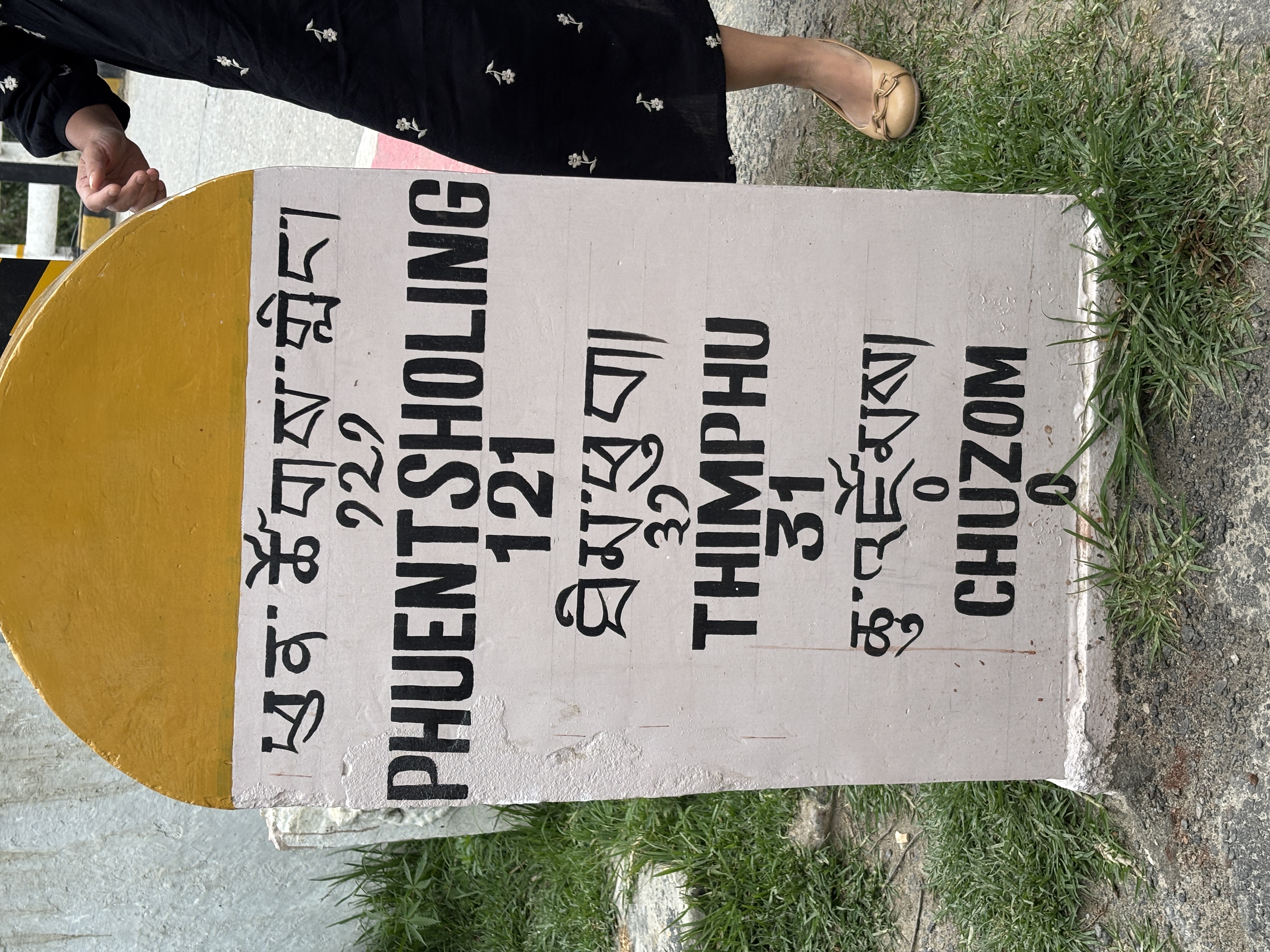 The milestone at the Confluence at Chhuzom Bridge
