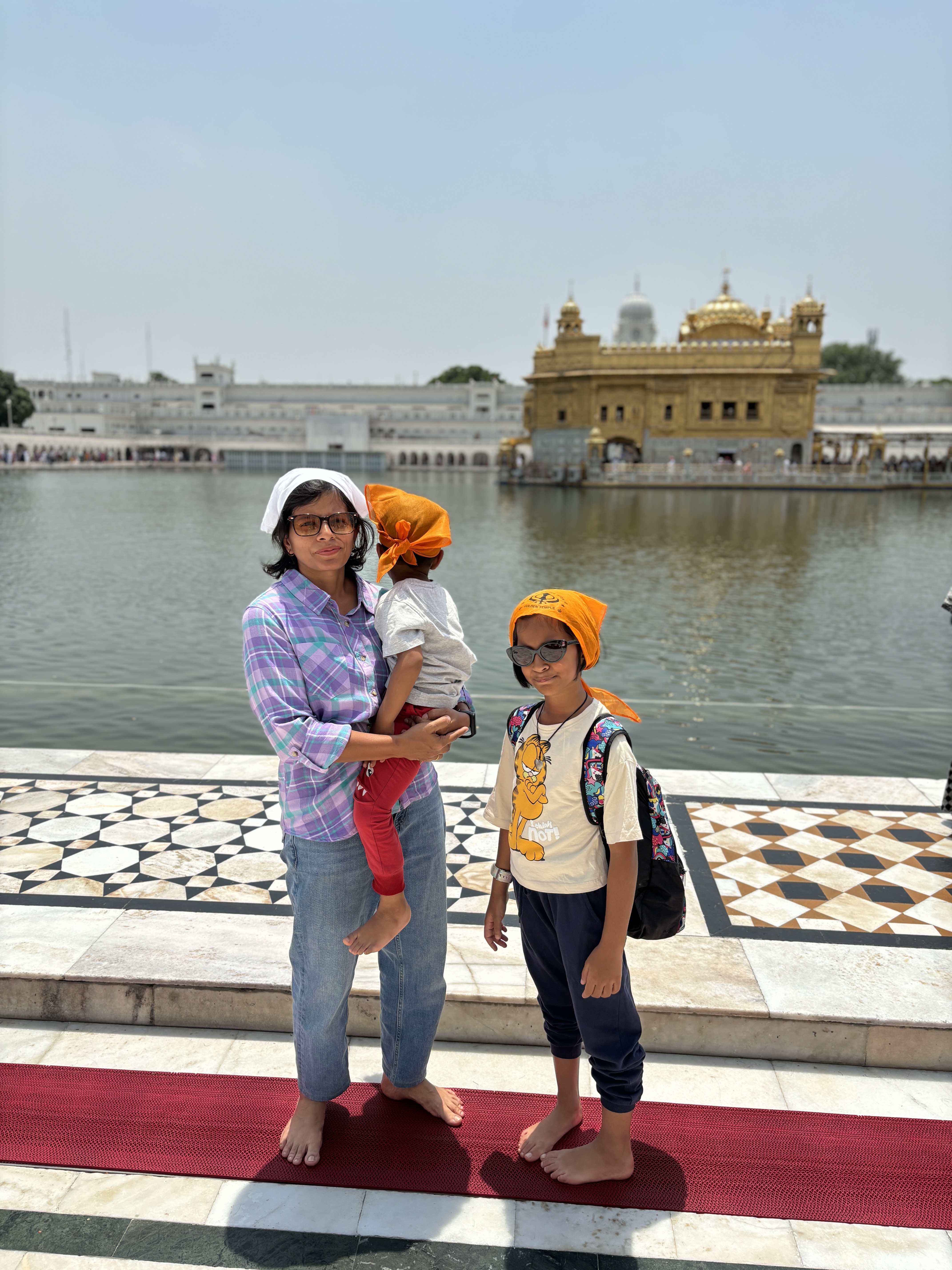 The view of golden temple, the ground was fire. Smiles hiding the shearing heat under the toes!