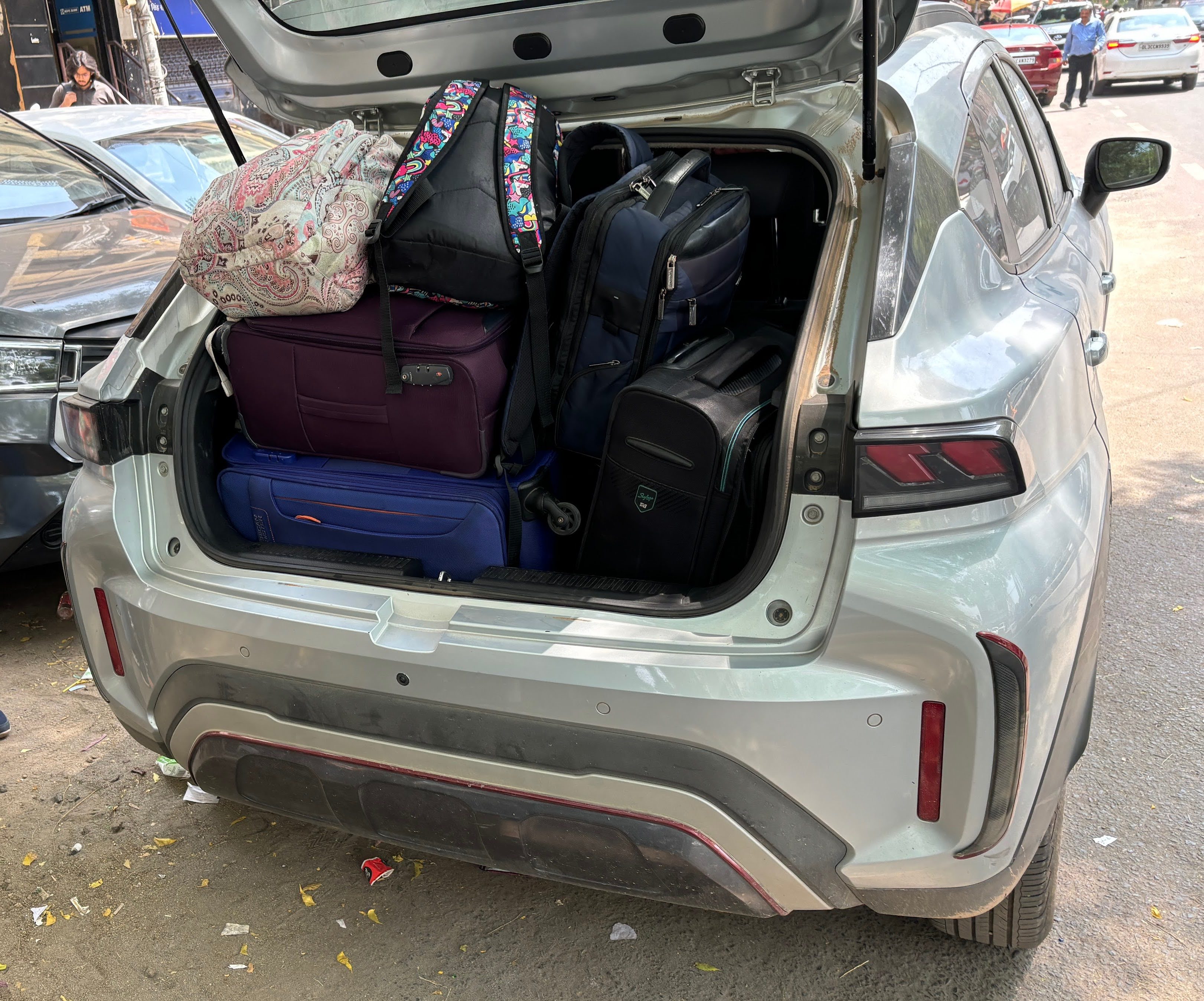 Unloading the packed car into a taxi