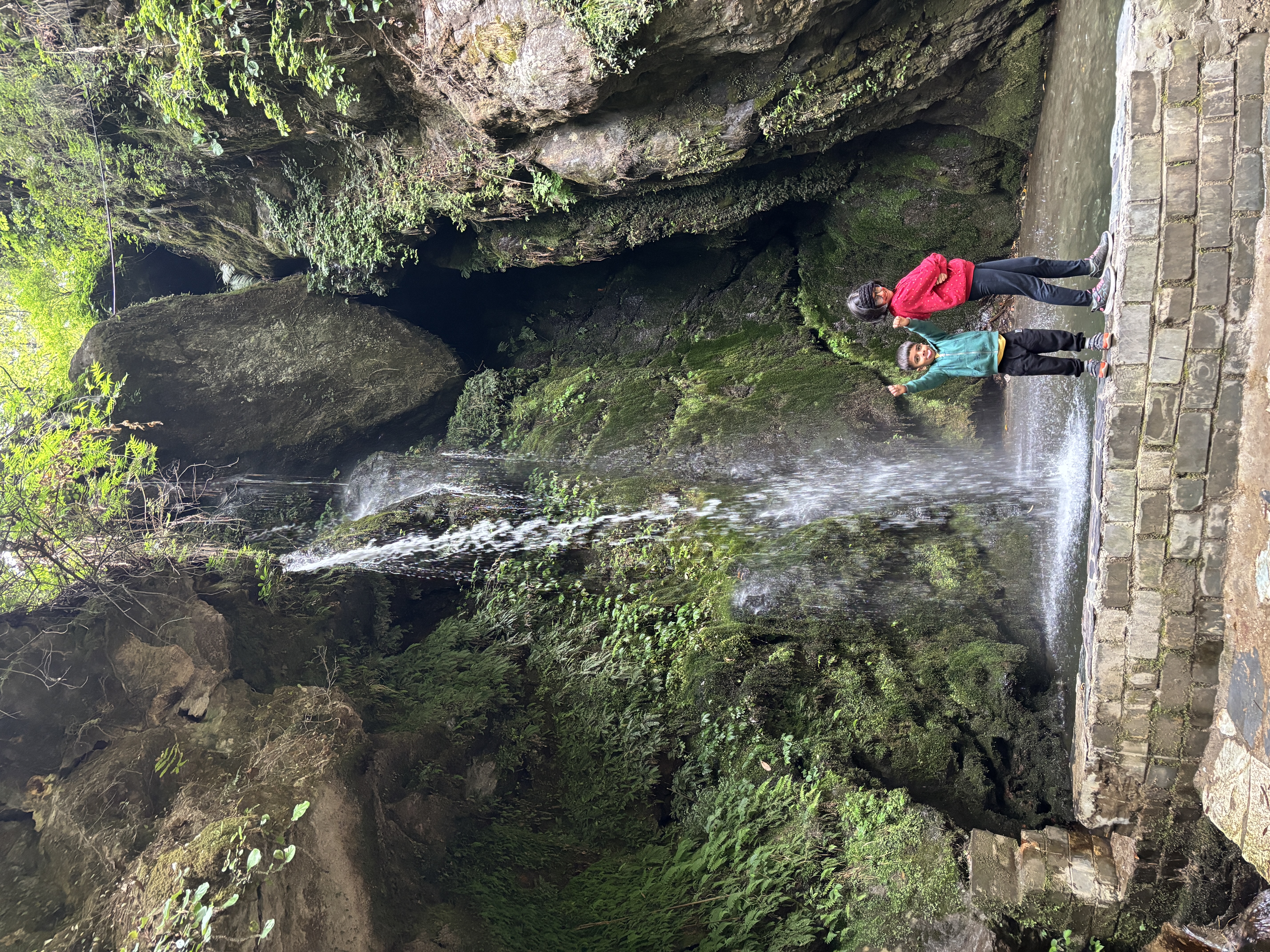 Posing in front of the Jibhi waterfall