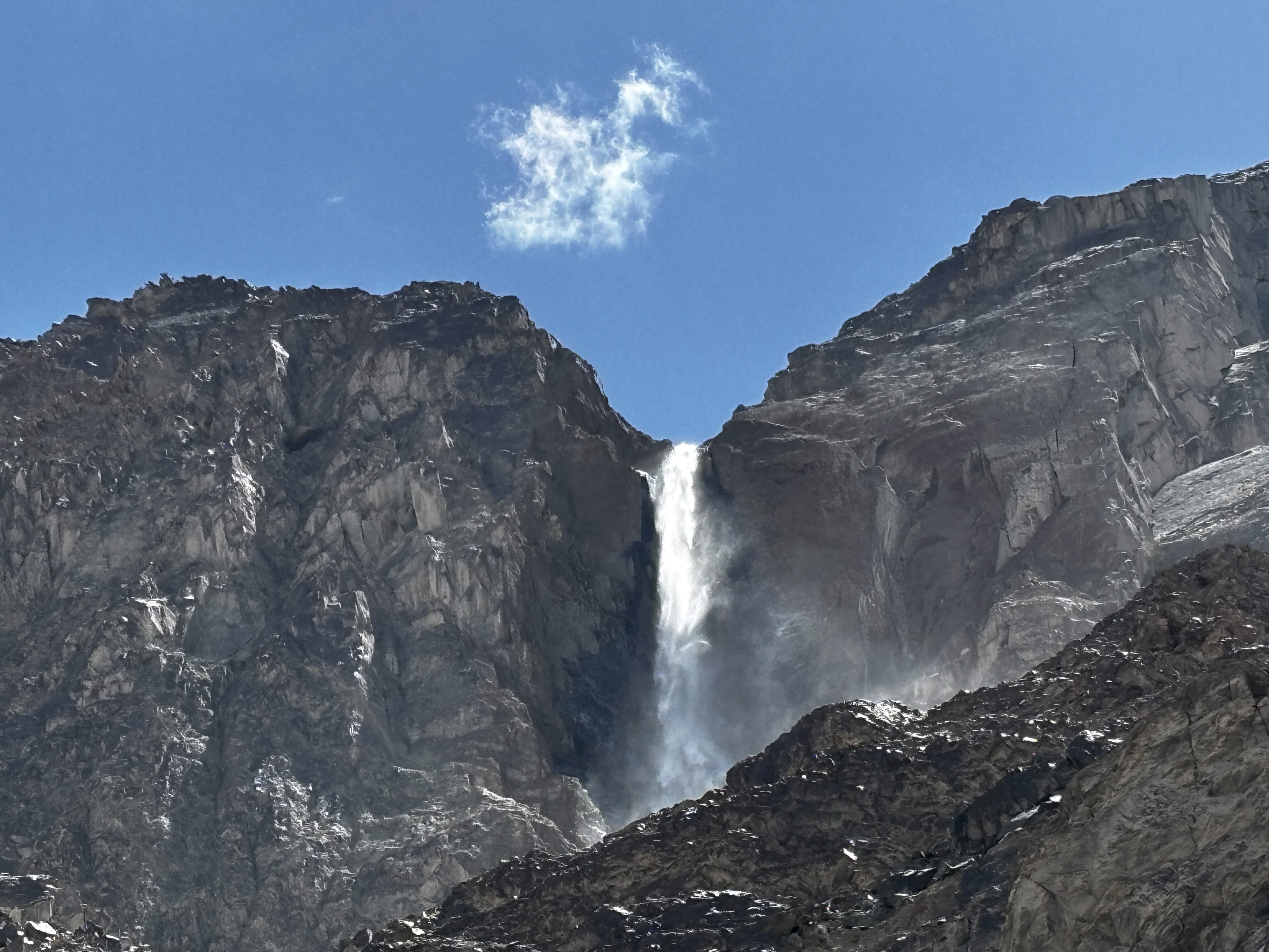 A waterfall finding its way from the rocky mountains