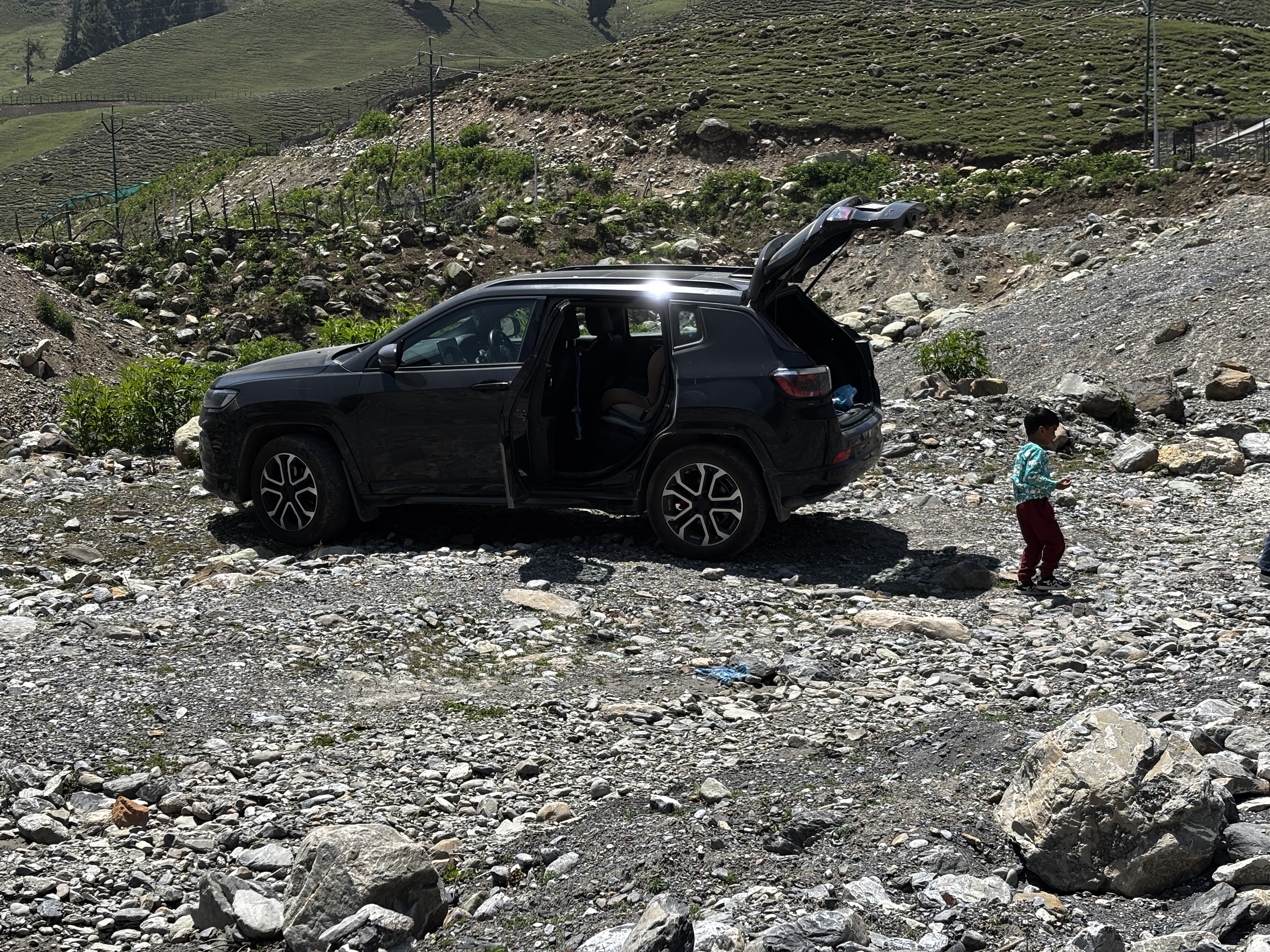 Off-roading adventure near the river after exiting Sonmarg tunnel