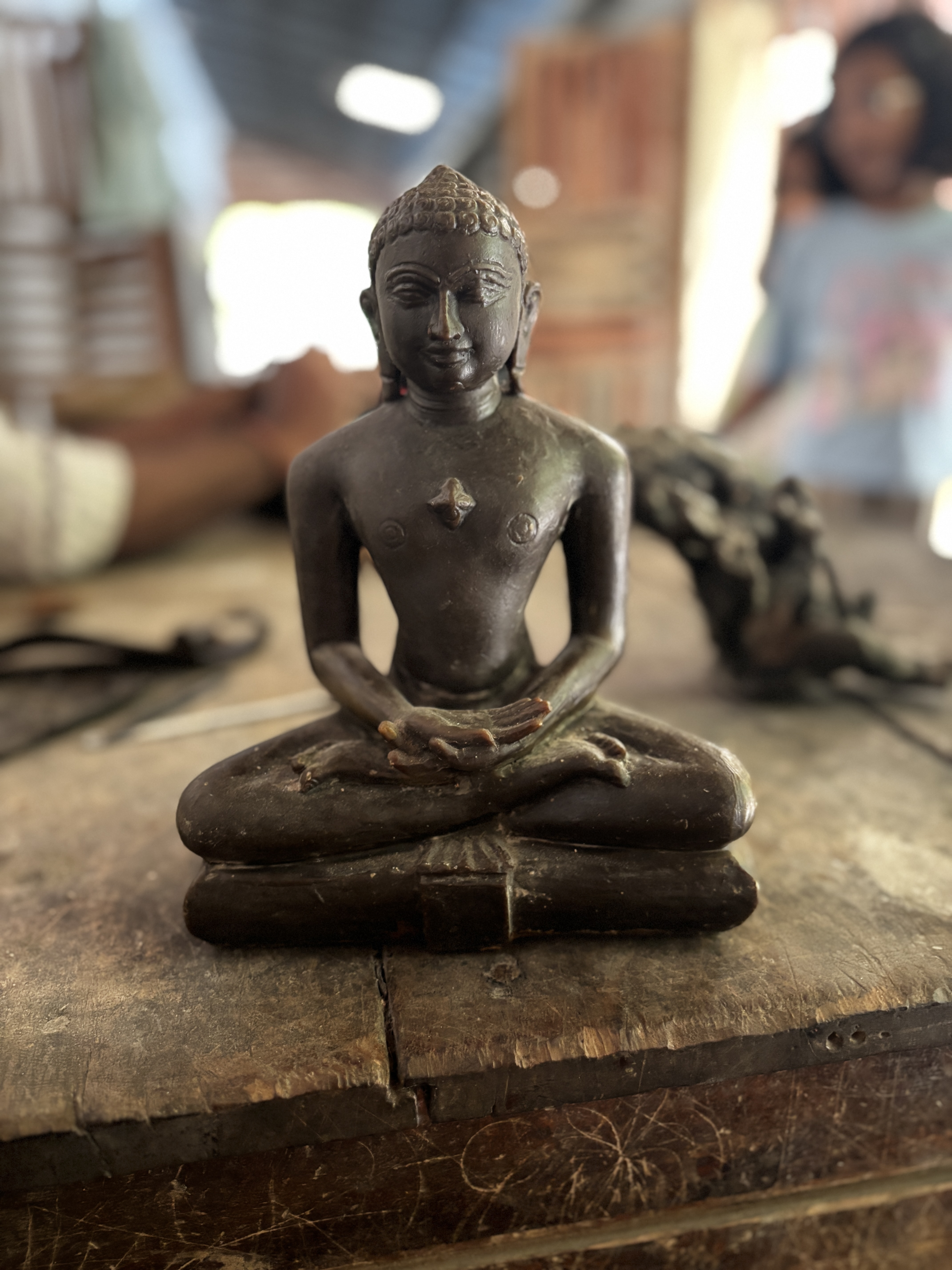 A wax statue to create a mould with clay. by wrapping clay around it