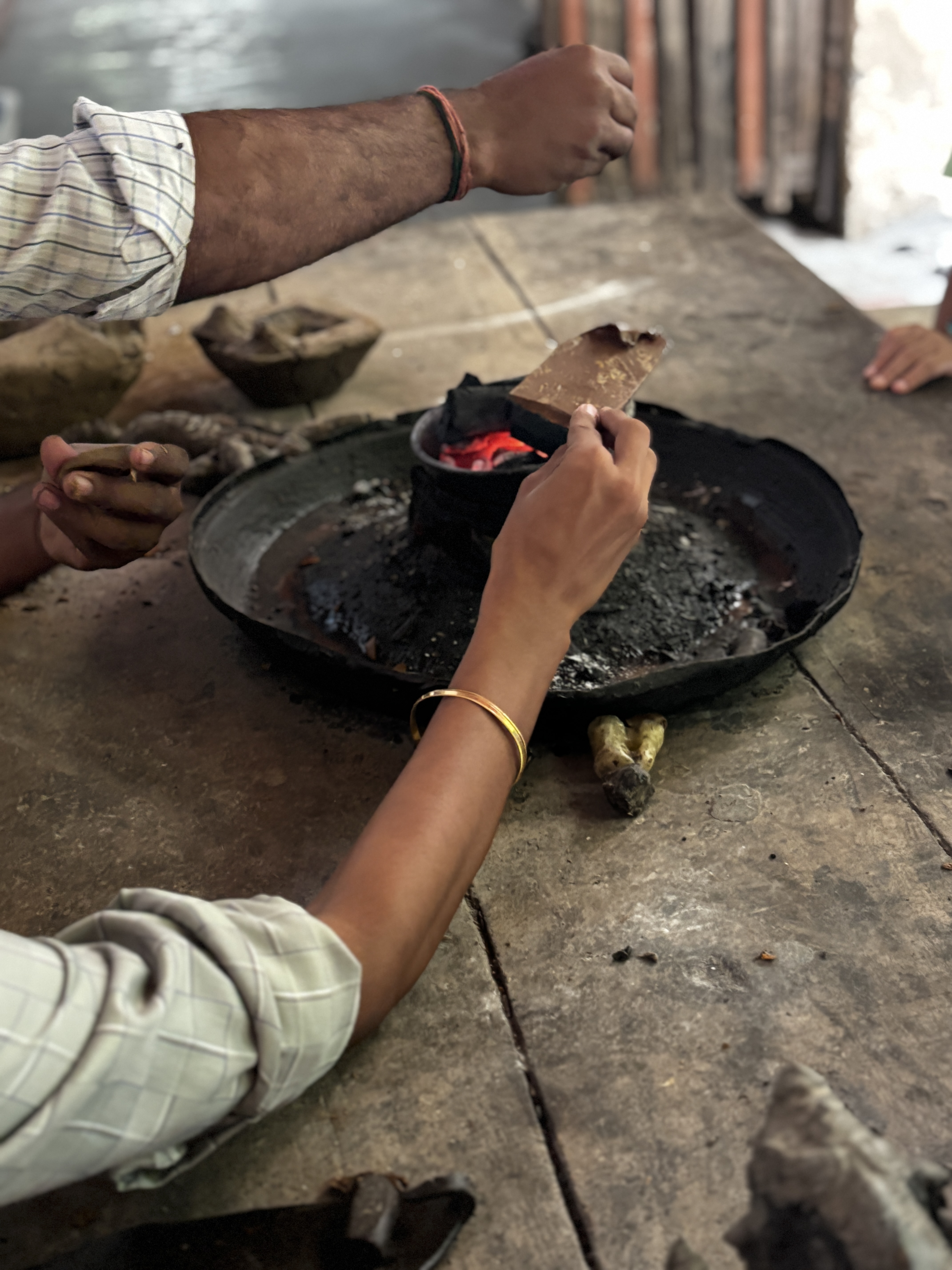Using fire and heat to shape the figure required to create the mould